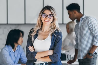 ekhealth.comimagesStock Imagesconfident-blonde-female-manager-posing-with-smile-after-conference-with-other-employees-asian-programmer-talking-wit